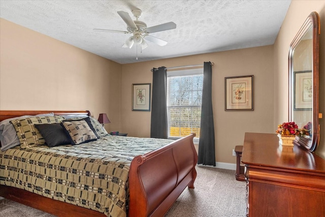 bedroom featuring carpet flooring, ceiling fan, a textured ceiling, and baseboards