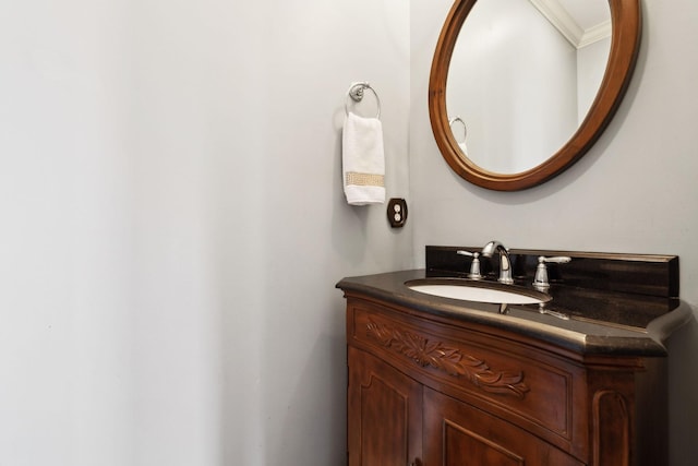 bathroom with vanity and ornamental molding