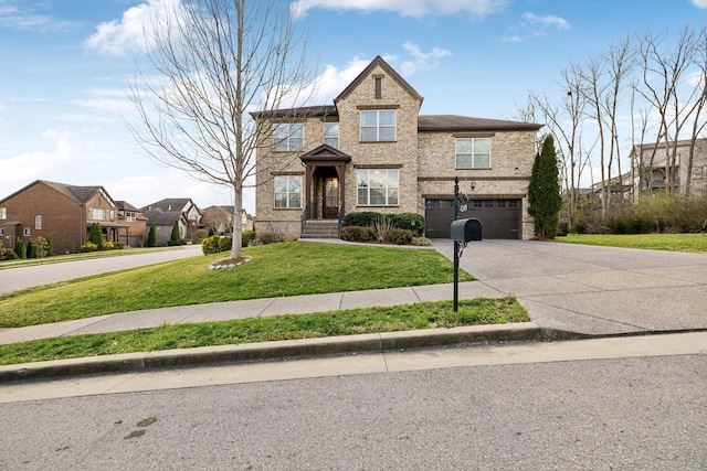 view of front facade with concrete driveway, an attached garage, brick siding, and a front yard