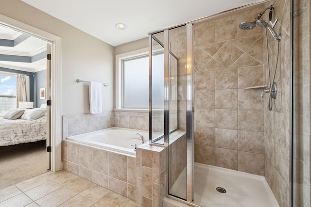 ensuite bathroom featuring a bath, a stall shower, ensuite bath, and ornamental molding