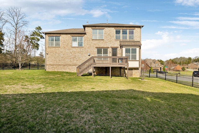 back of house featuring brick siding, a yard, a wooden deck, and a fenced backyard