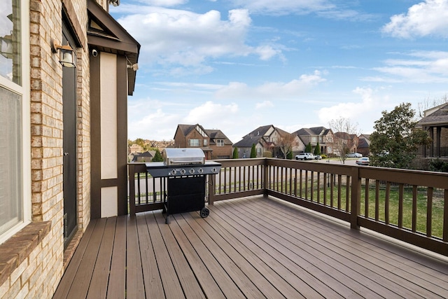 deck featuring grilling area and a residential view