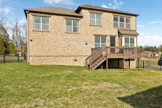 rear view of property with stairway, a lawn, a fenced backyard, and a wooden deck