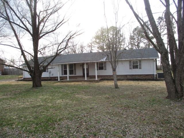 single story home with covered porch and a front lawn