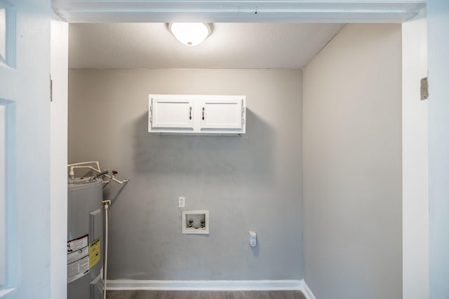 laundry area with wood finished floors, water heater, laundry area, and hookup for a washing machine