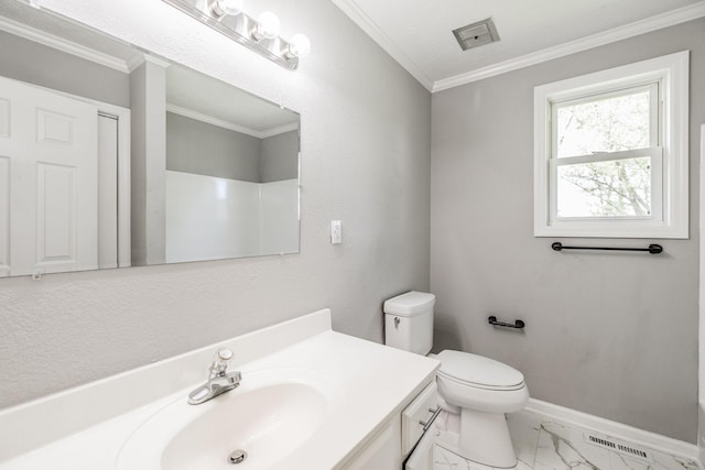 bathroom featuring vanity, marble finish floor, baseboards, toilet, and ornamental molding