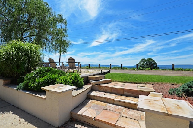 view of patio / terrace with a water view