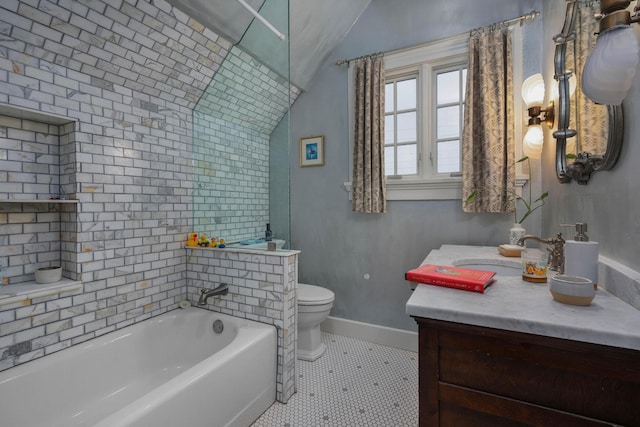 full bathroom featuring vanity, baseboards, vaulted ceiling, toilet, and a bathtub