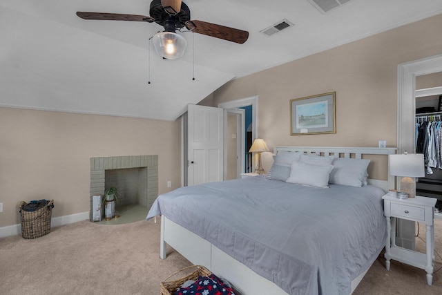 bedroom with lofted ceiling, carpet flooring, baseboards, and visible vents