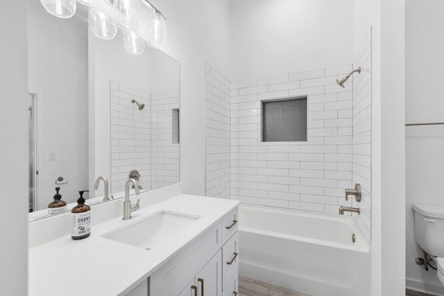 bathroom with toilet, vanity, and shower / tub combination