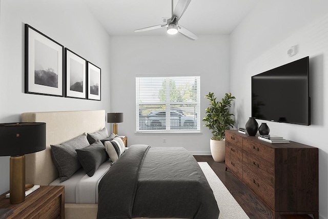 bedroom featuring baseboards, a ceiling fan, and dark wood-style flooring