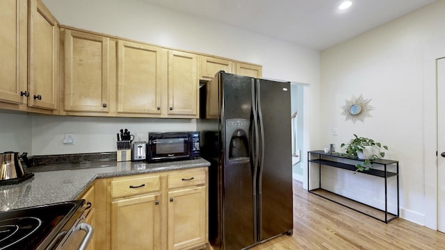 kitchen with baseboards, light brown cabinetry, light wood-type flooring, recessed lighting, and black appliances