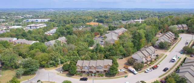 bird's eye view featuring a forest view and a residential view