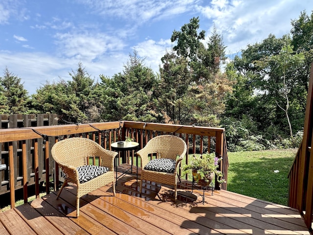 wooden deck with a lawn