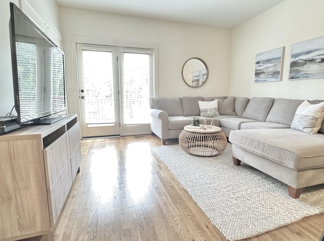 living area with light wood-style floors