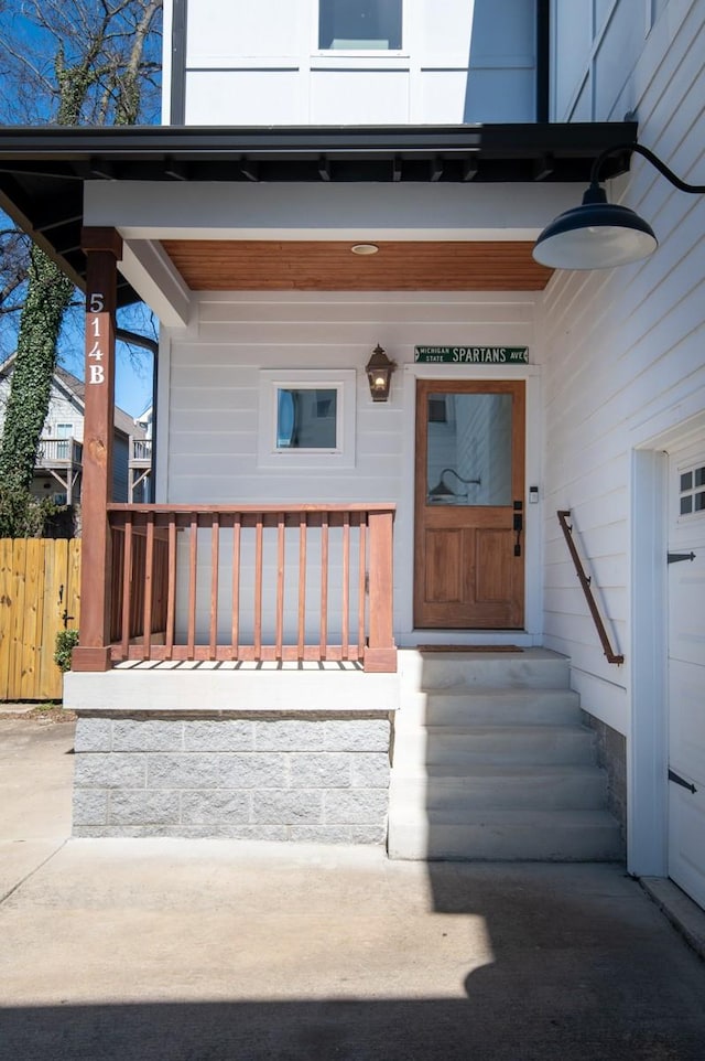 doorway to property featuring covered porch