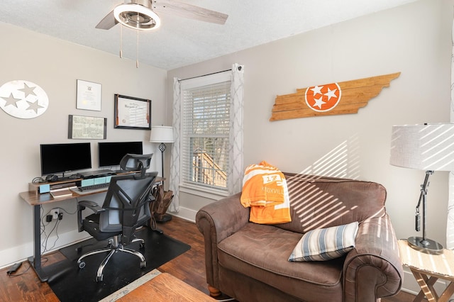 office area featuring a textured ceiling, baseboards, a ceiling fan, and wood finished floors