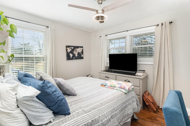 bedroom with wood finished floors and a ceiling fan