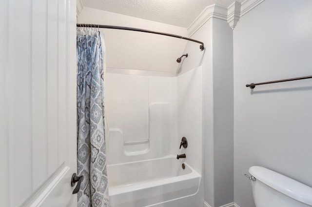 full bath with a textured ceiling, shower / tub combo, and toilet