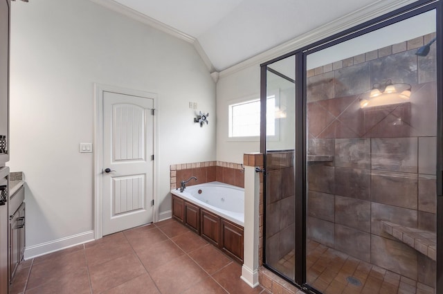 bathroom with a jetted tub, a shower stall, crown molding, lofted ceiling, and tile patterned flooring