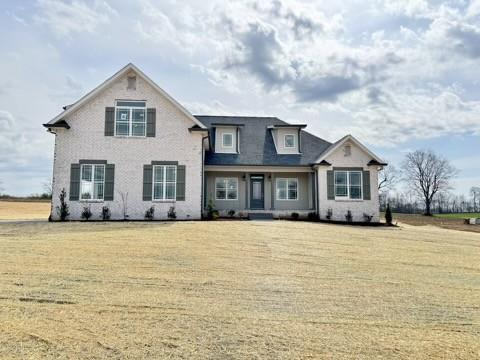 view of front of home featuring a front lawn