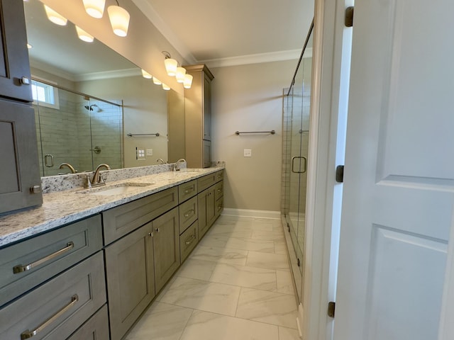 full bathroom featuring double vanity, marble finish floor, crown molding, and a sink