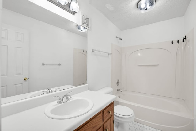 full bathroom with visible vents, toilet, a textured ceiling, washtub / shower combination, and vanity