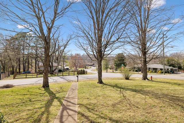 view of yard with a residential view and fence