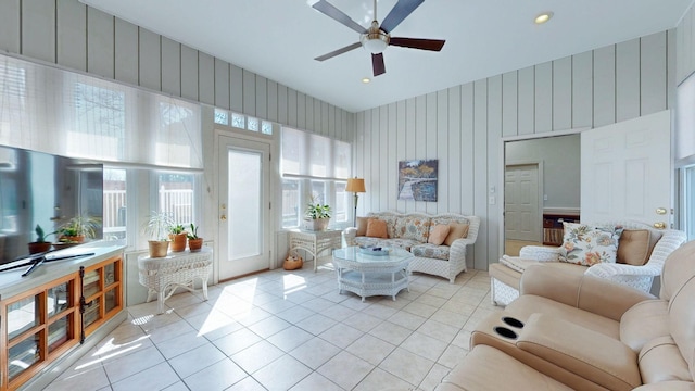 living room with light tile patterned floors and a ceiling fan