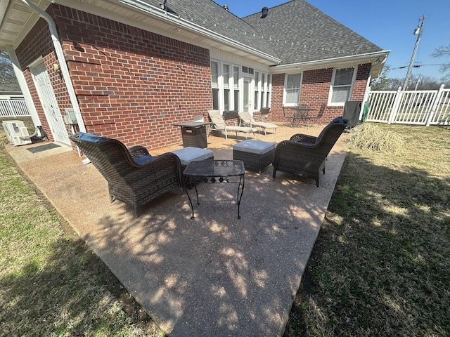 view of patio / terrace featuring fence