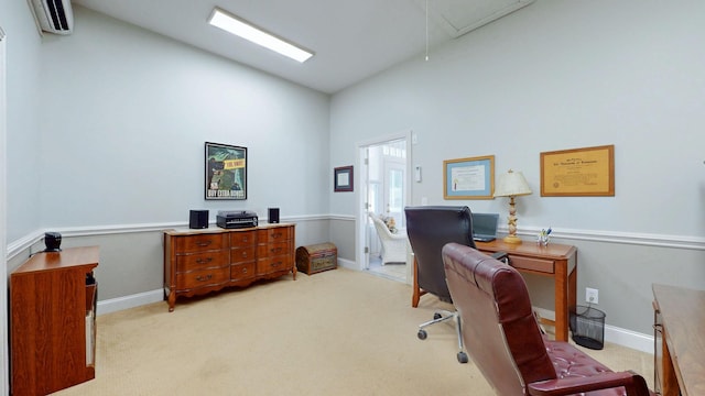 office space with a wall unit AC, baseboards, carpet floors, lofted ceiling, and attic access