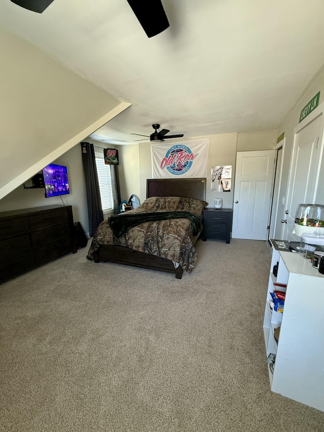bedroom featuring ceiling fan and carpet