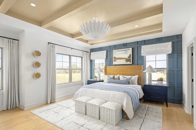 bedroom with beam ceiling, recessed lighting, baseboards, and light wood-style floors