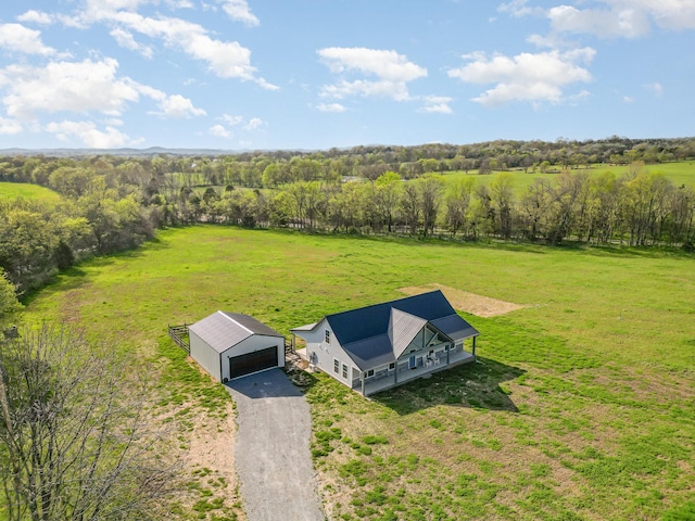 birds eye view of property with a rural view