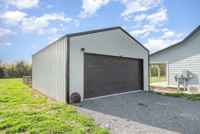 detached garage featuring ac unit