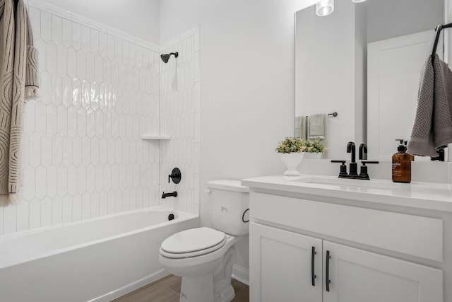 full bathroom with vanity,  shower combination, toilet, and wood finished floors