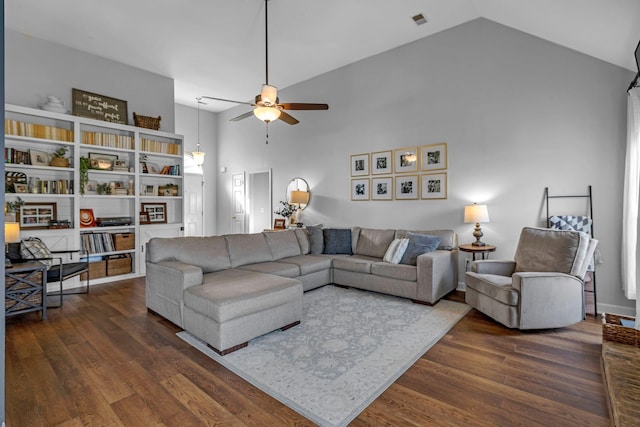 living room featuring dark wood-style floors, a ceiling fan, visible vents, and high vaulted ceiling