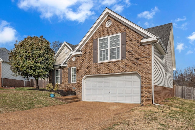 traditional home with fence, concrete driveway, a front lawn, a garage, and brick siding