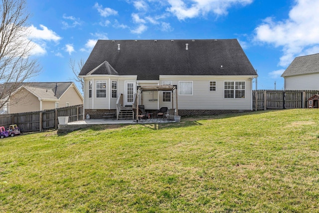 back of property featuring entry steps, a patio area, a lawn, and a fenced backyard