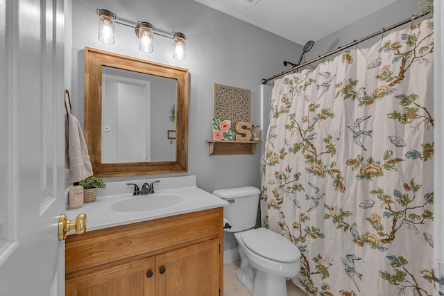 bathroom featuring curtained shower, toilet, and vanity