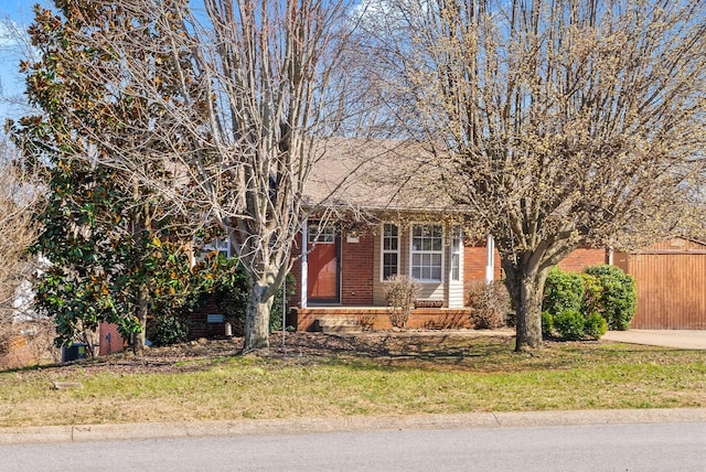 obstructed view of property with brick siding