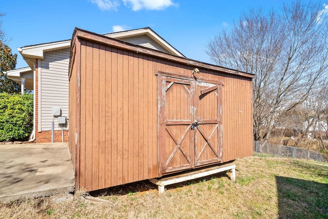 view of shed with fence