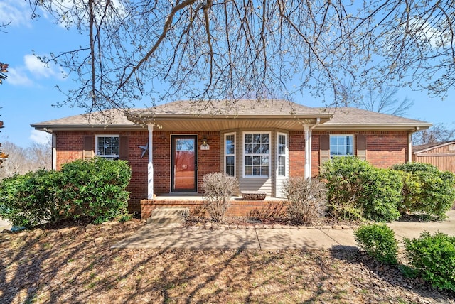 ranch-style house featuring brick siding