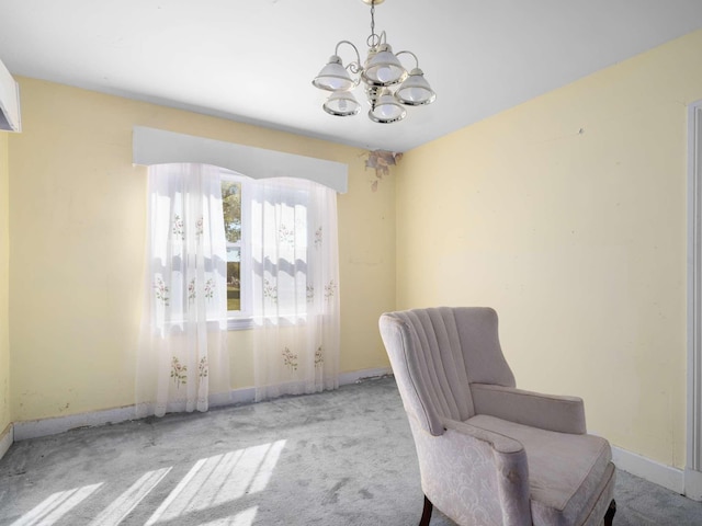 unfurnished room with baseboards, carpet, and a chandelier