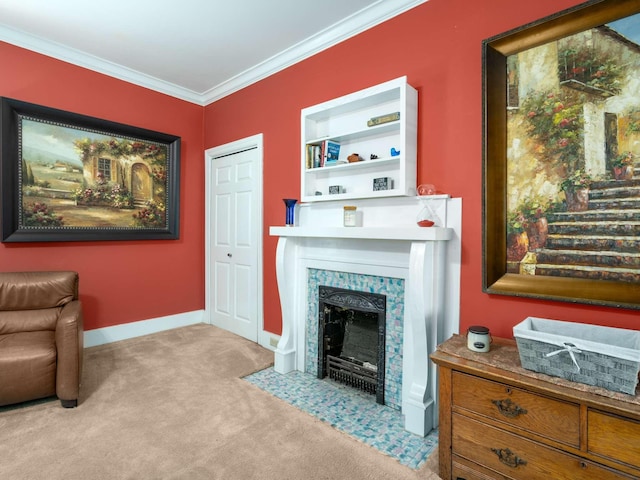 living area featuring a fireplace with flush hearth, crown molding, baseboards, and carpet floors