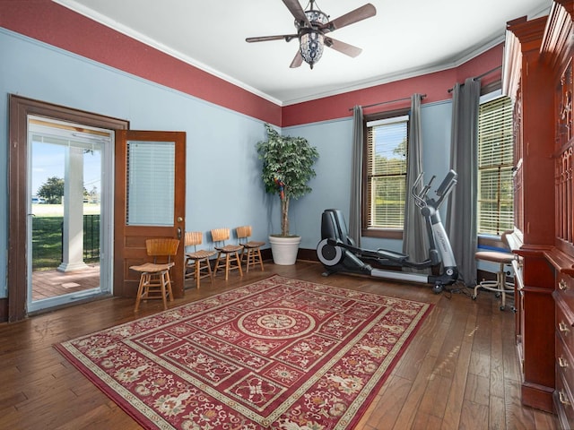 living area with a wealth of natural light, hardwood / wood-style floors, ceiling fan, and ornamental molding