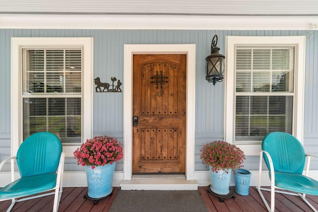 view of exterior entry with covered porch