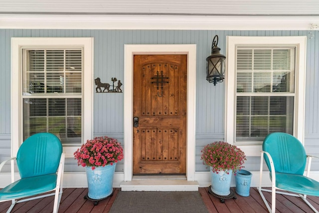 doorway to property featuring covered porch