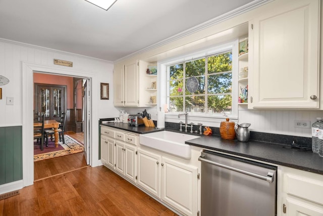 kitchen with dark wood-style floors, open shelves, a sink, stainless steel dishwasher, and dark countertops