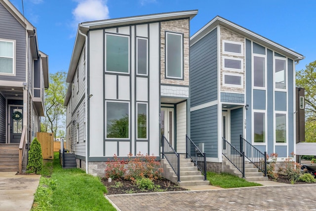 contemporary house featuring entry steps